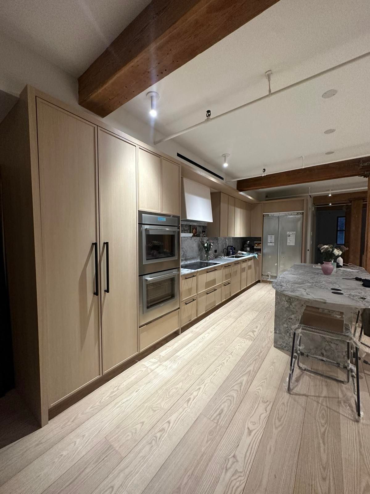 Custom kitchen cabinetry in a New York loft by The Slate Contracting Corp.